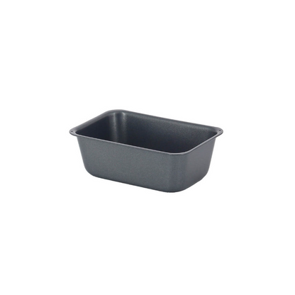 Single De Buyer mini loaf mould showing its non stick coating on a white background