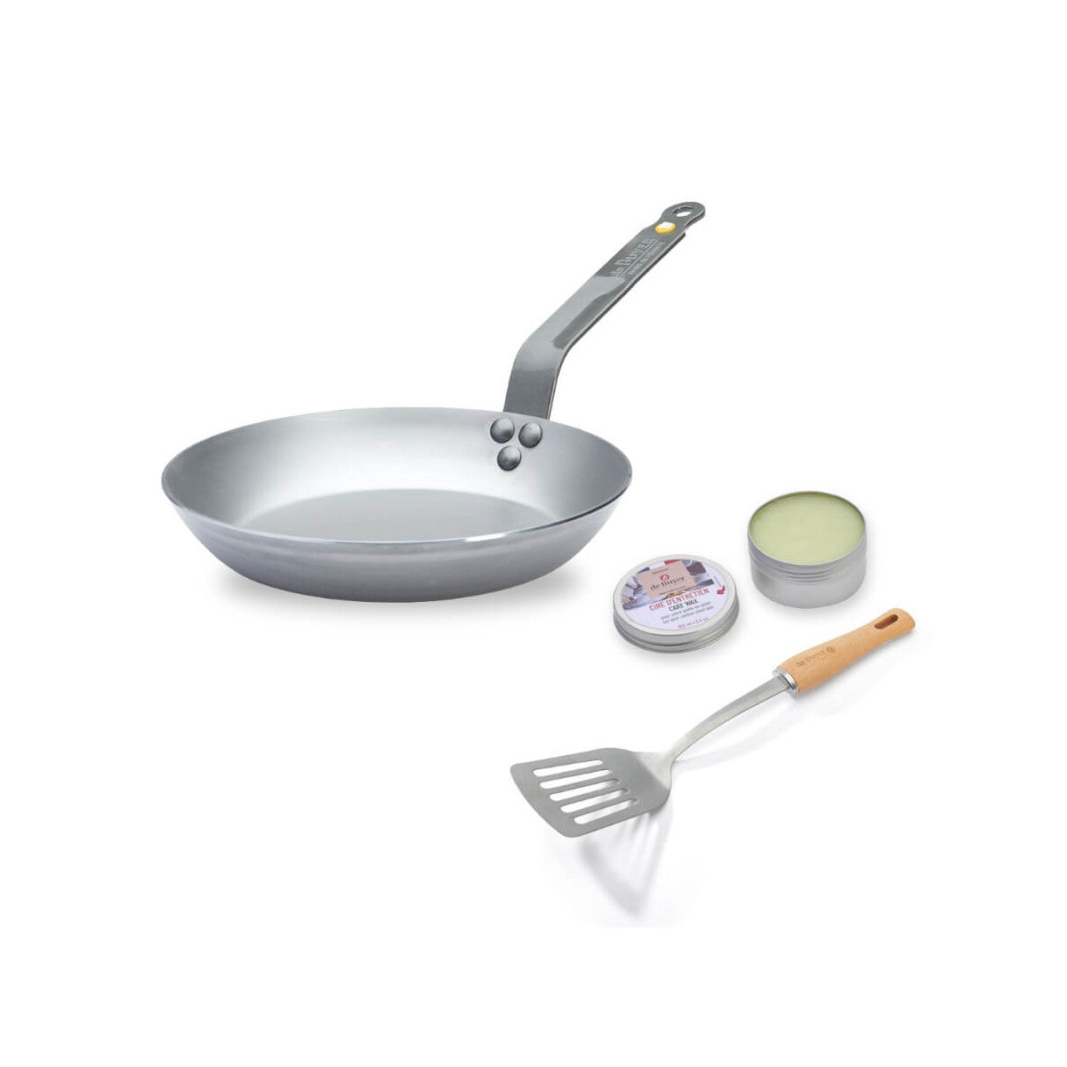 Silver frying pan with a spatula and small containers on a white background